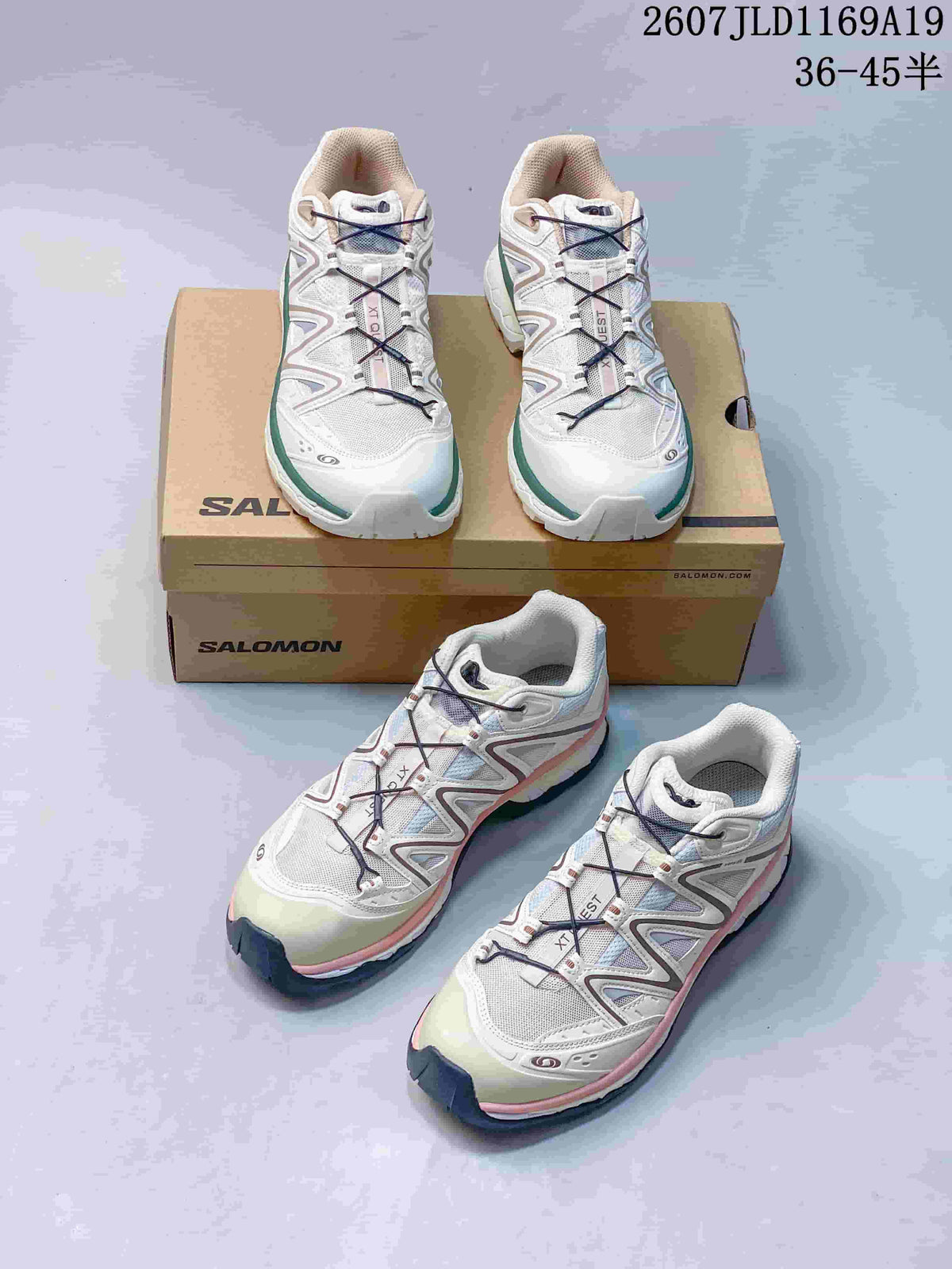 Multiple views of white Salomon XT-Quest sneakers with green and pink trim colorways arranged around Salomon shoeboxes; overlay shows style code 2607JLD1169A19 and size range 36–45.5.