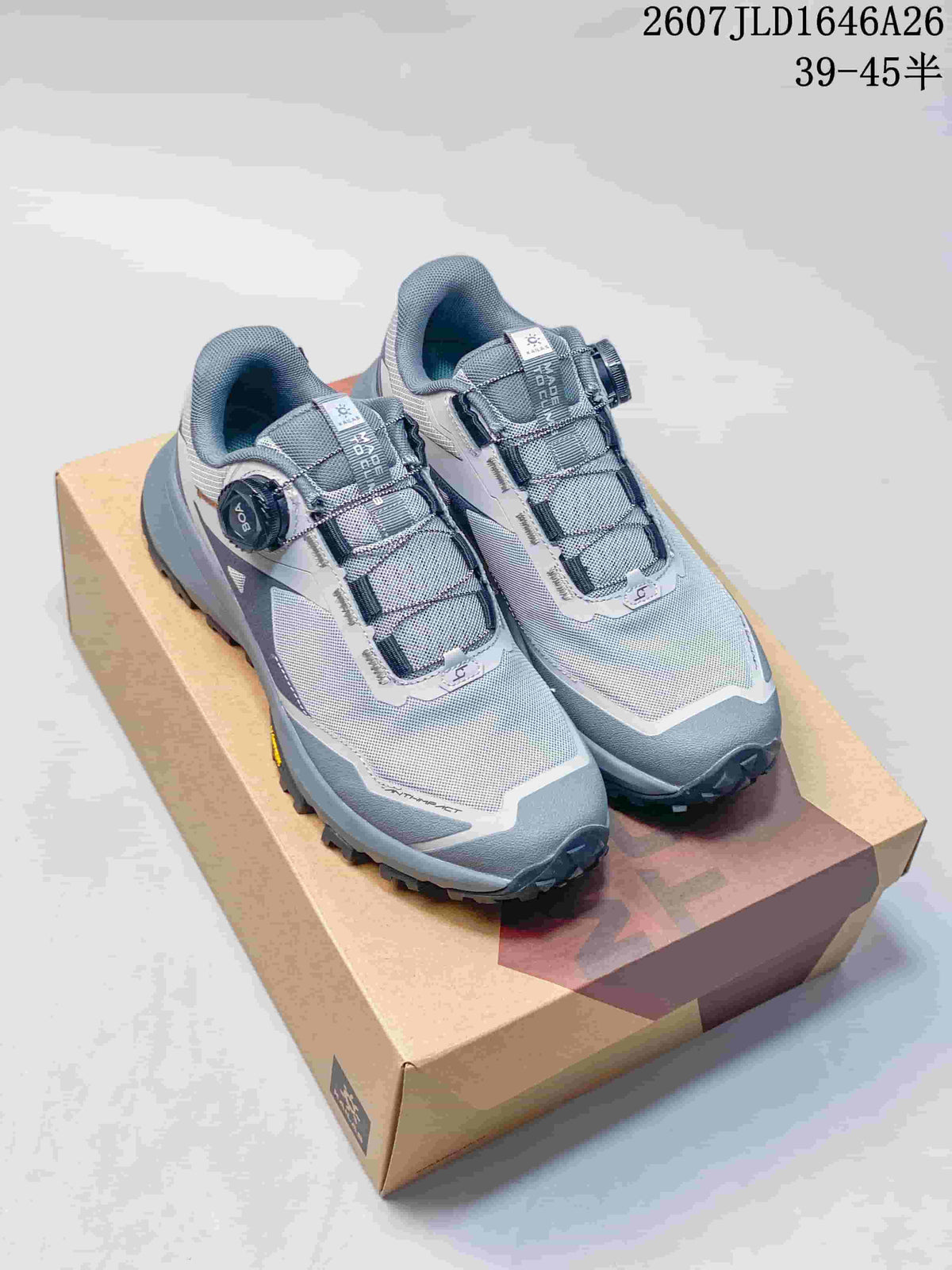 Pair of gray and white Kailas low-top hiking shoes displayed on a shoebox, with BOA dials and a visible style-size overlay.
