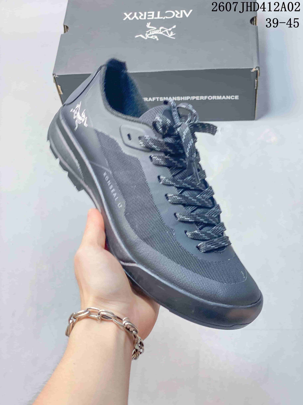 Dark gray Arc'teryx Konseal LT W shoe with patterned upper and lugged outsole.