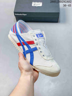 White Onitsuka Tiger slip-on sneaker with blue and red side stripes