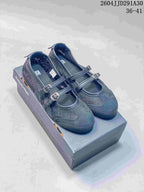 Pair of dark navy Mary Jane sneakers with two buckle straps