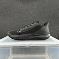 Side view of an all-black Nike Precision 7 basketball shoe