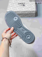 Close-up of the dark blue-gray rubber outsole showing concentric circular traction grooves and Nike Air branding.