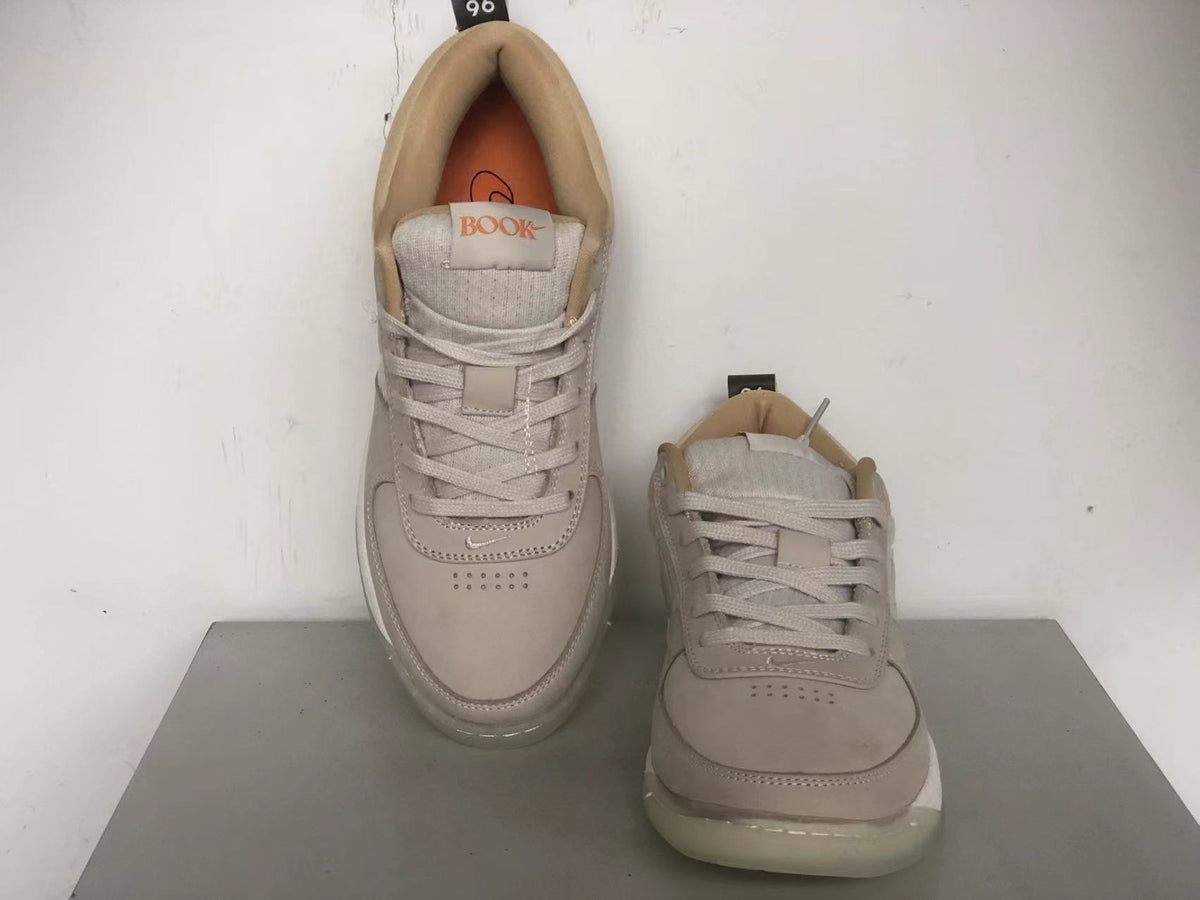 Top view of the Nike Book 1 shoes showing the laces, toe perforations, and tongue branding.