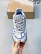 Top view of a lace-up sneaker with a white and lavender upper; image text states sizes 36–45½