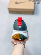 Rear view of the sneaker showing the padded heel, red pull tab, white midsole, and split-color outsole.