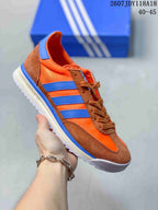 Orange and brown adidas SL 72 sneaker with bright blue stripes.