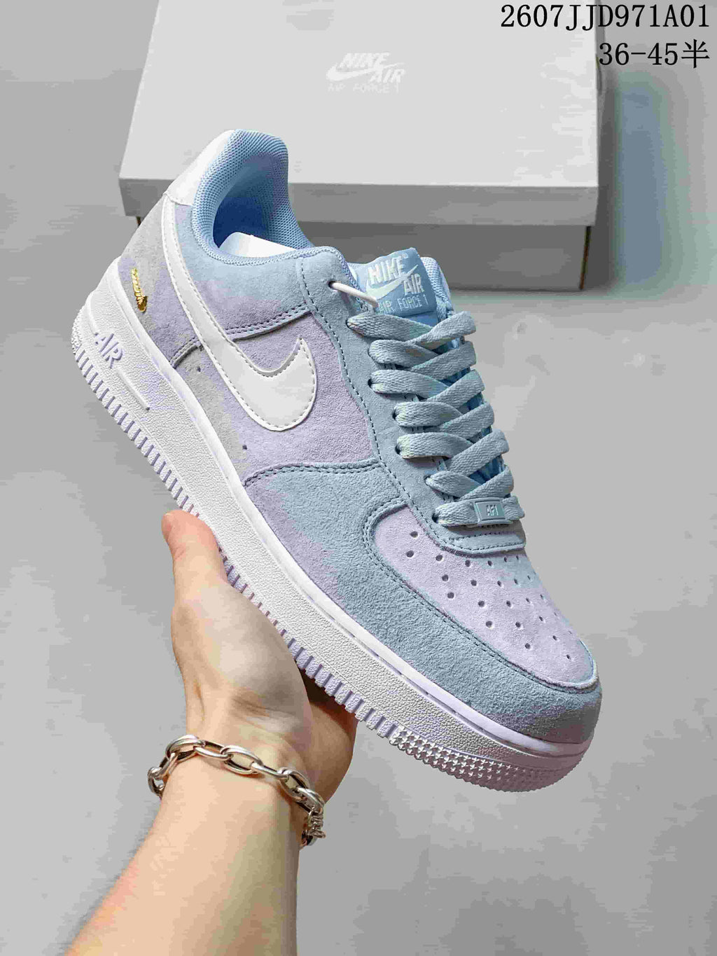 Angled view of the pastel color-blocked sneaker and side Swoosh