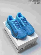 Pair of blue Nike ACG trail shoes with dark accents
