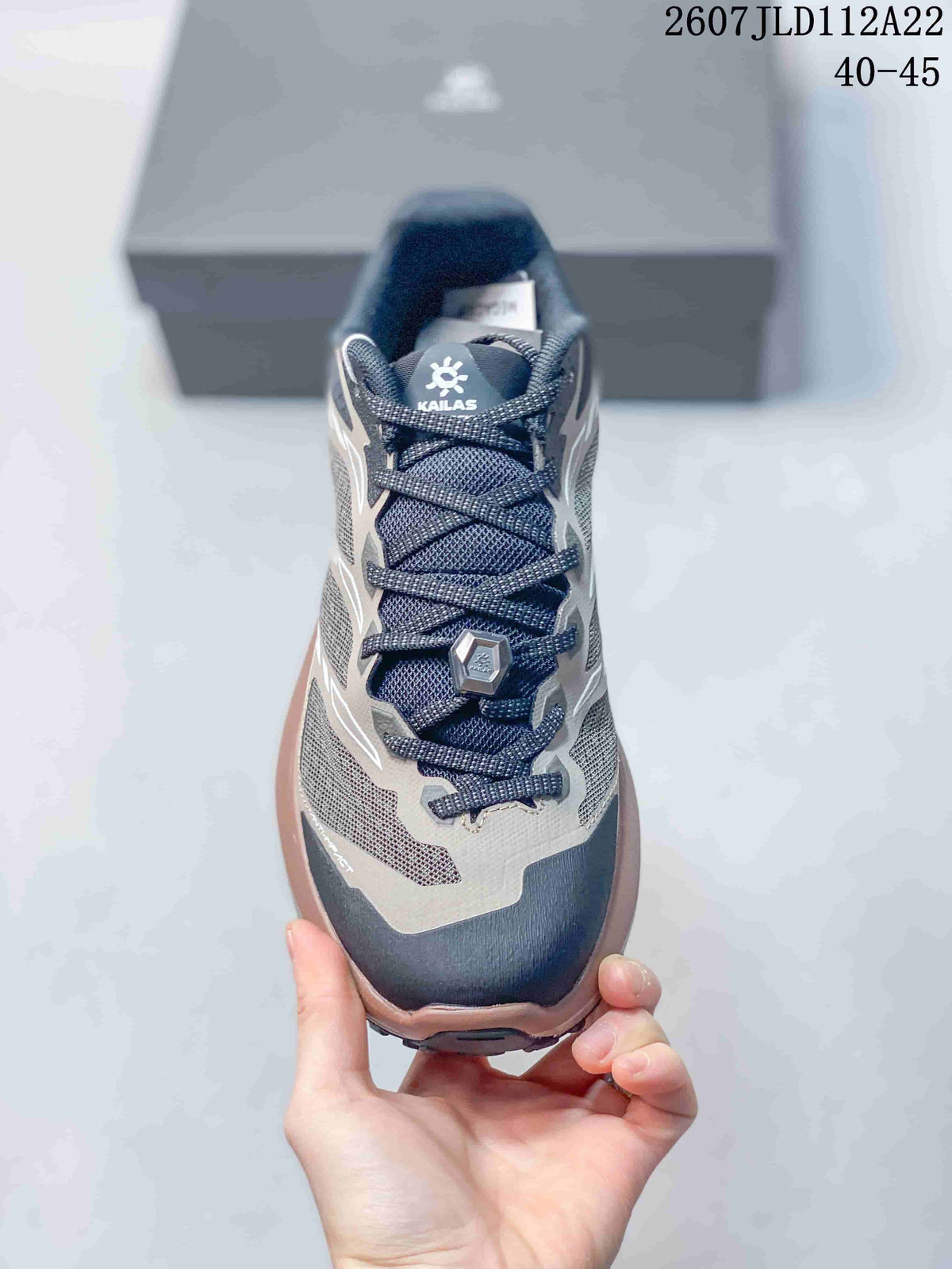 Top-down view showing the navy mesh tongue, lace-up closure, toe protection, and gray upper panels.