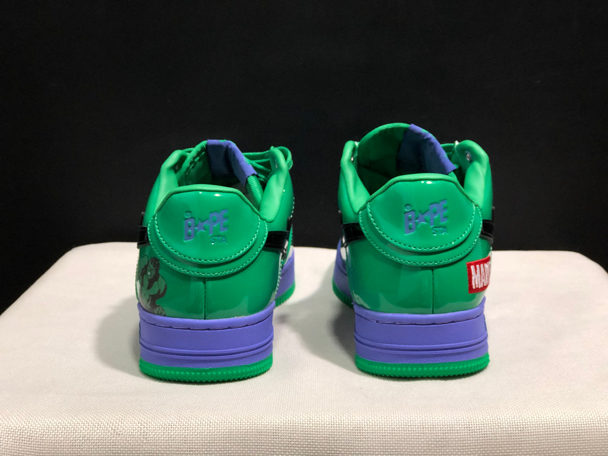 Rear view showing BAPE STA heel branding, purple midsoles and Marvel graphic accents.