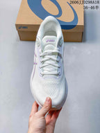 Top view of the ASICS running shoe showing the mesh-like toe area, tongue and white laces.