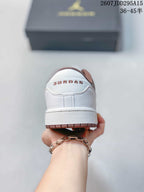 Rear view of the sneaker showing Jordan branding on the white heel panel and brown outsole edge.
