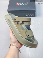 Close-up of an olive-toned adjustable strap sandal showing the straps and footbed.