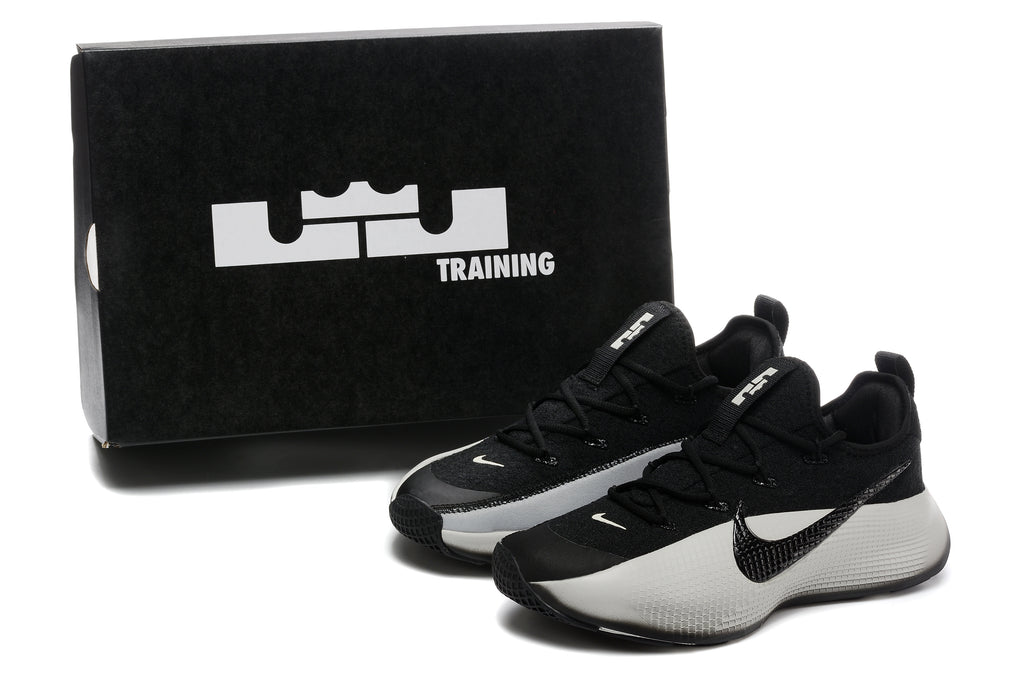 Black and light gray LeBron TR1 shoes beside a black Training box