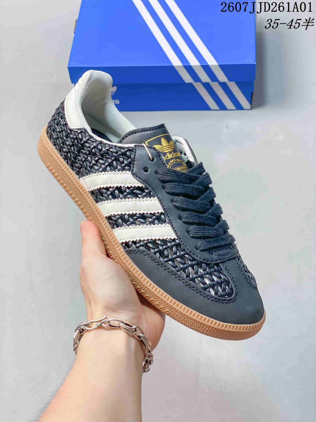 Angled view of the dark Samba-style sneaker with woven-look panels