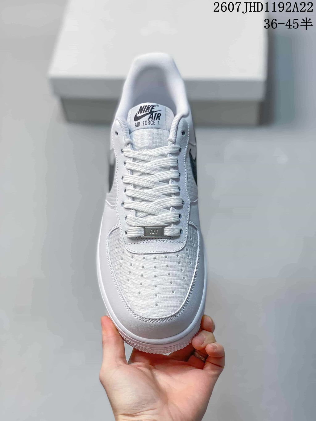 Top view showing the white laces, tongue branding, and perforated toe box.