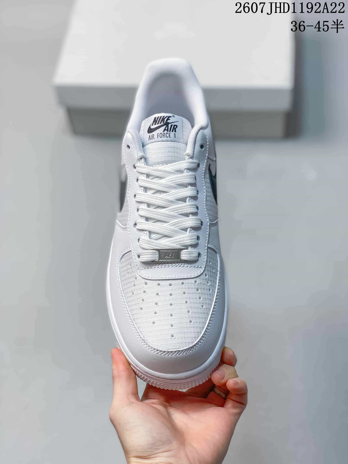 Top view showing the white laces, tongue branding, and perforated toe box.