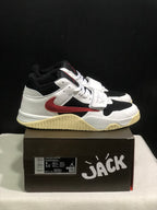 Side view of the white and black high-top sneakers showing the red side branding and cream outsole.