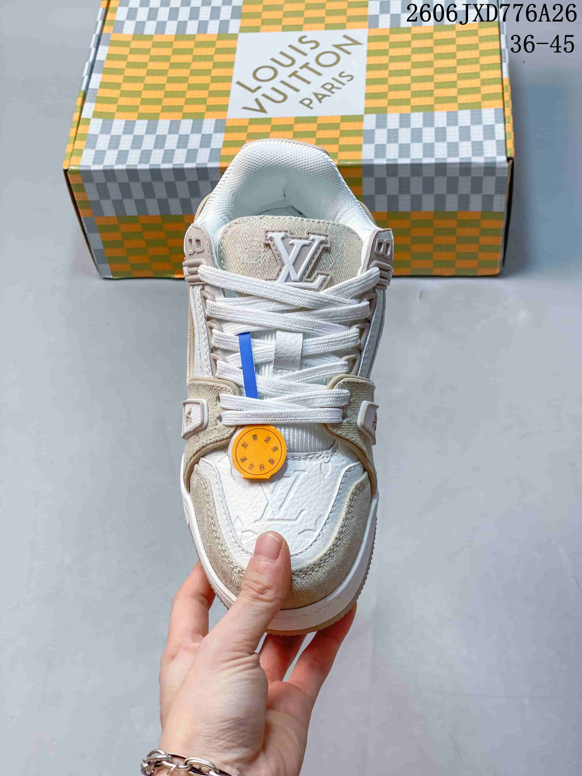 Front view of a white and beige Louis Vuitton Trainer sneaker