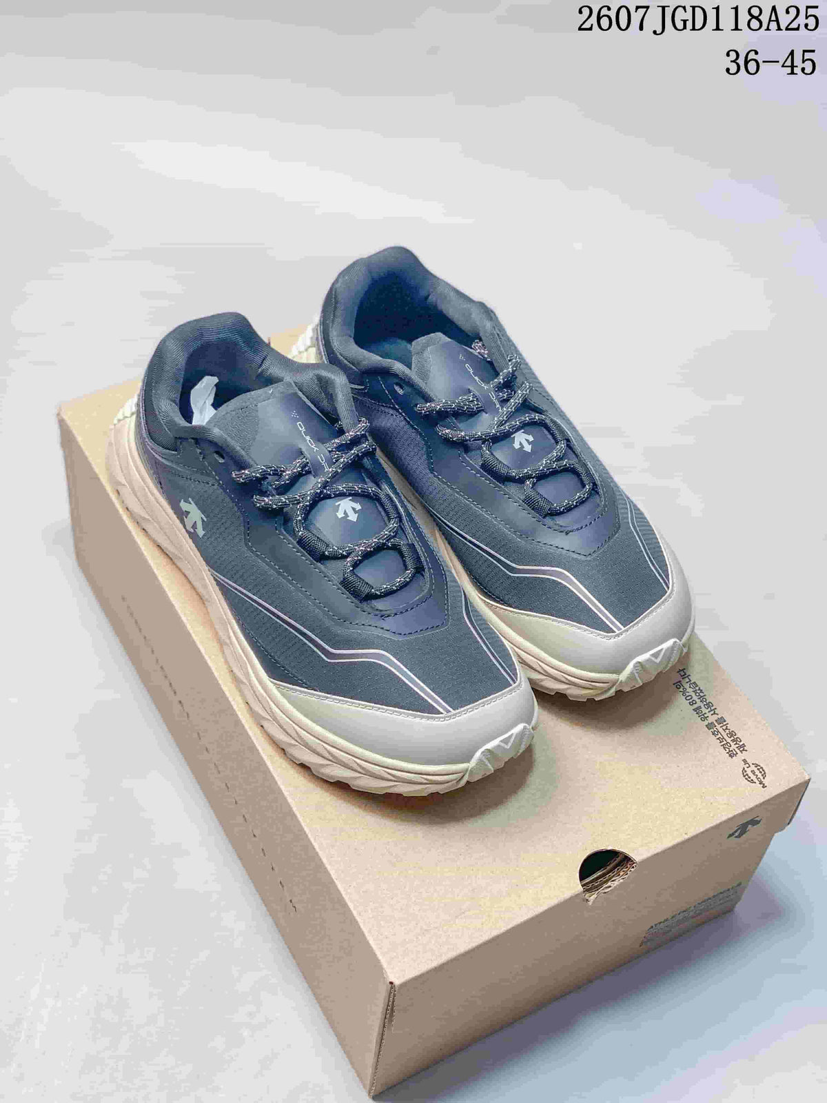 Pair of navy and cream Descente TERRAIND sneakers displayed on a shoebox; the image also shows the text 36–45.