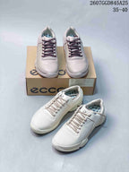 Multiple views of white ECCO Biom C sneakers with the ECCO shoebox, showing the lace-up design, perforated panels and patterned inner lining.