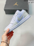 Side profile showing the light lavender upper, white Swoosh-style side branding, and textured sole.