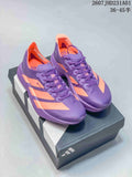 Pair of purple and coral Adidas Adizero running shoes on a shoebox
