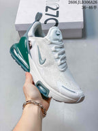 Angled side view of the white and teal Nike Air Max 270 sneaker