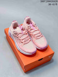 Pair of pink and white Nike Free Metcon 7 training shoes displayed on an orange shoe box, with style code JDD620A20 and a 36–41.5 size range shown above.