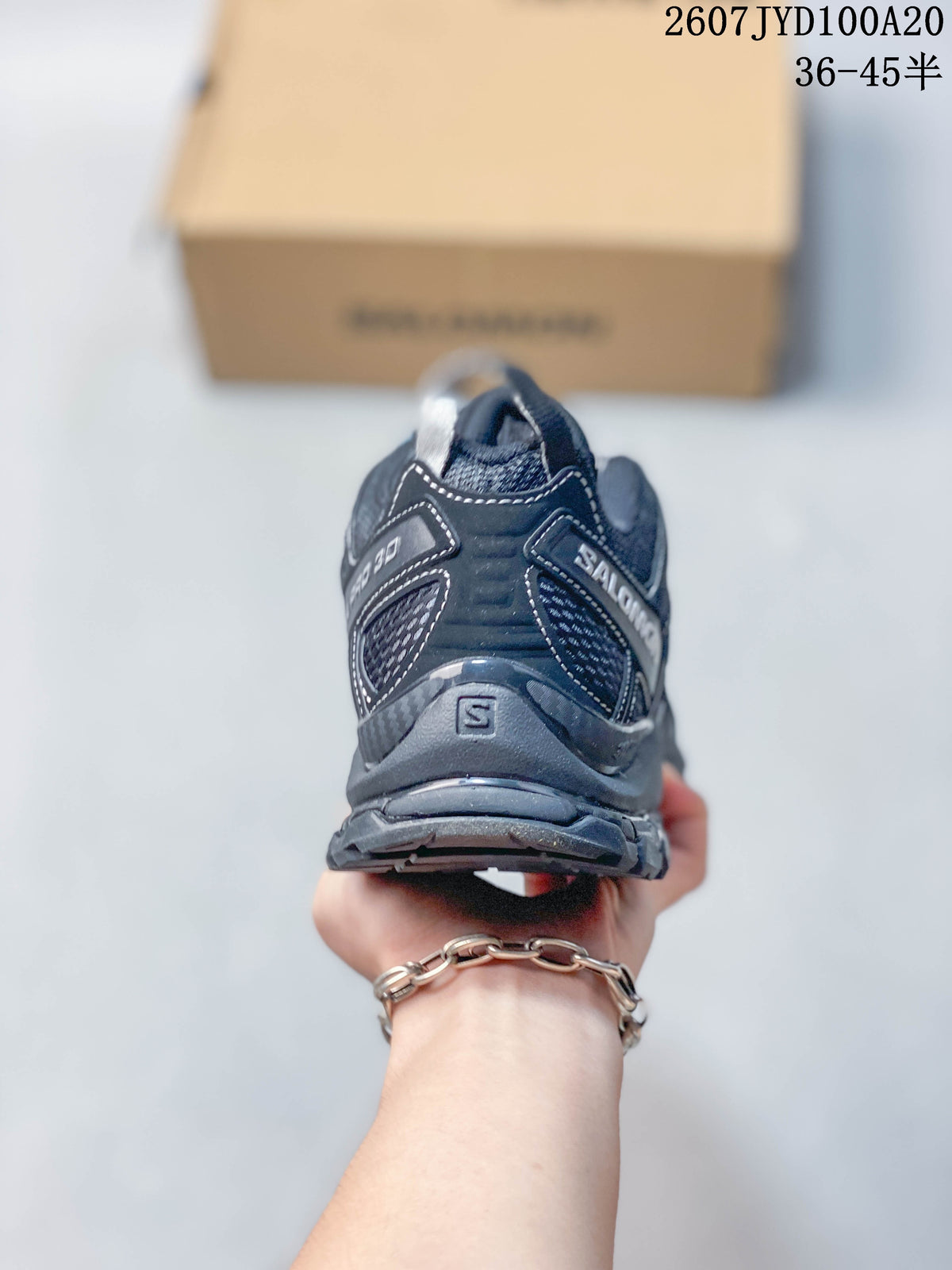 Rear view showing the padded heel structure, pull tabs and Salomon branding.