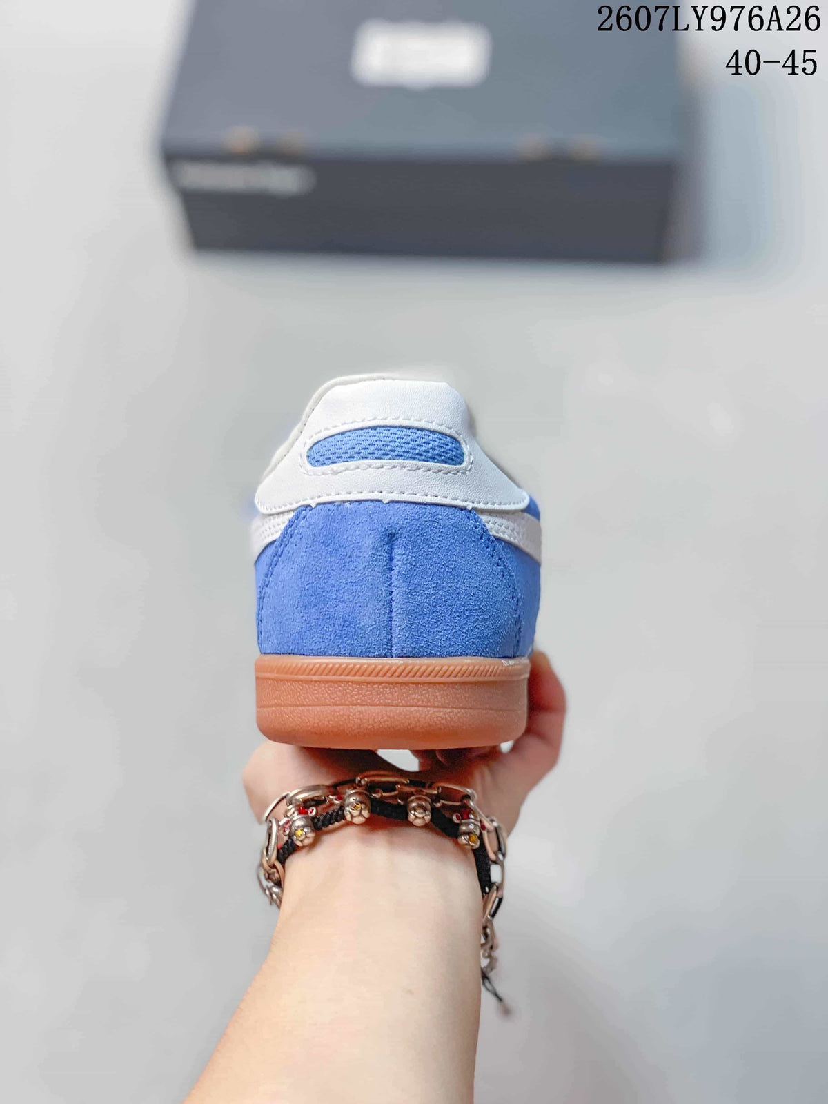 Rear view of the blue sneaker showing the white heel collar and gum-colored sole.