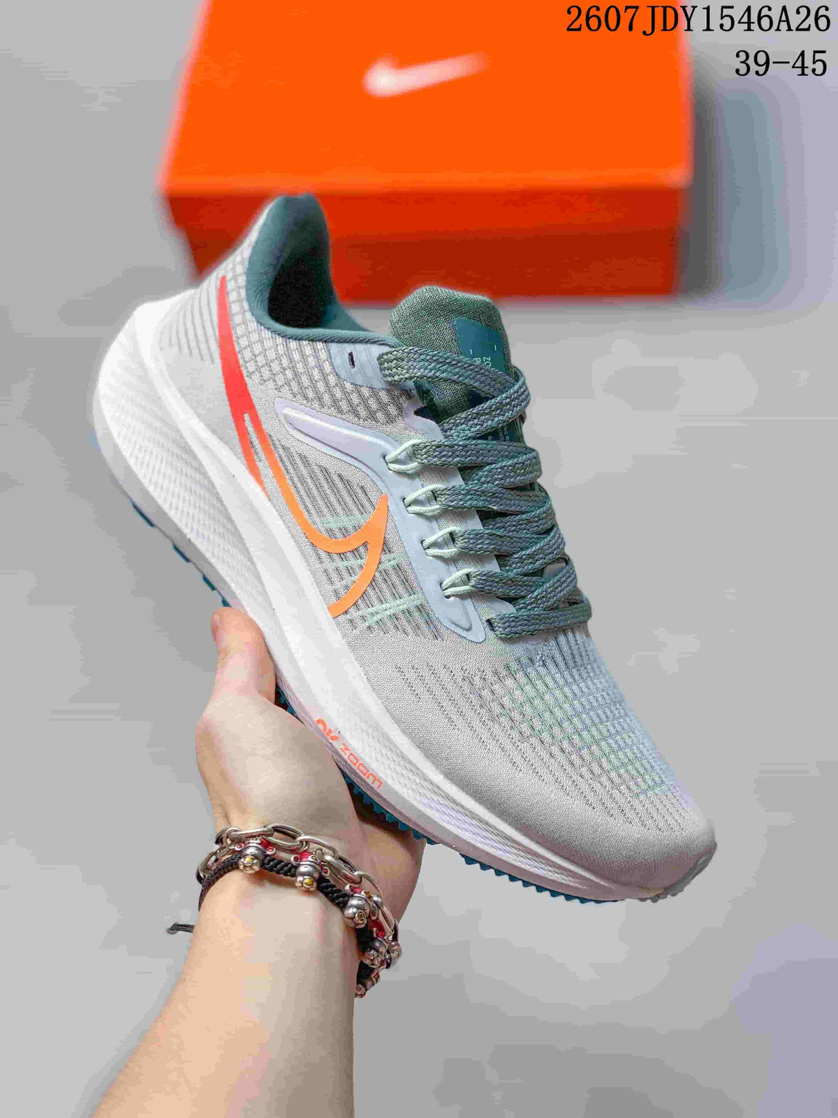 Light gray Nike Air Zoom Pegasus 39 sneaker with orange side branding and gray-green laces.