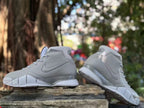 Side and rear views of the grey Nike Kobe 1 FTB shoes