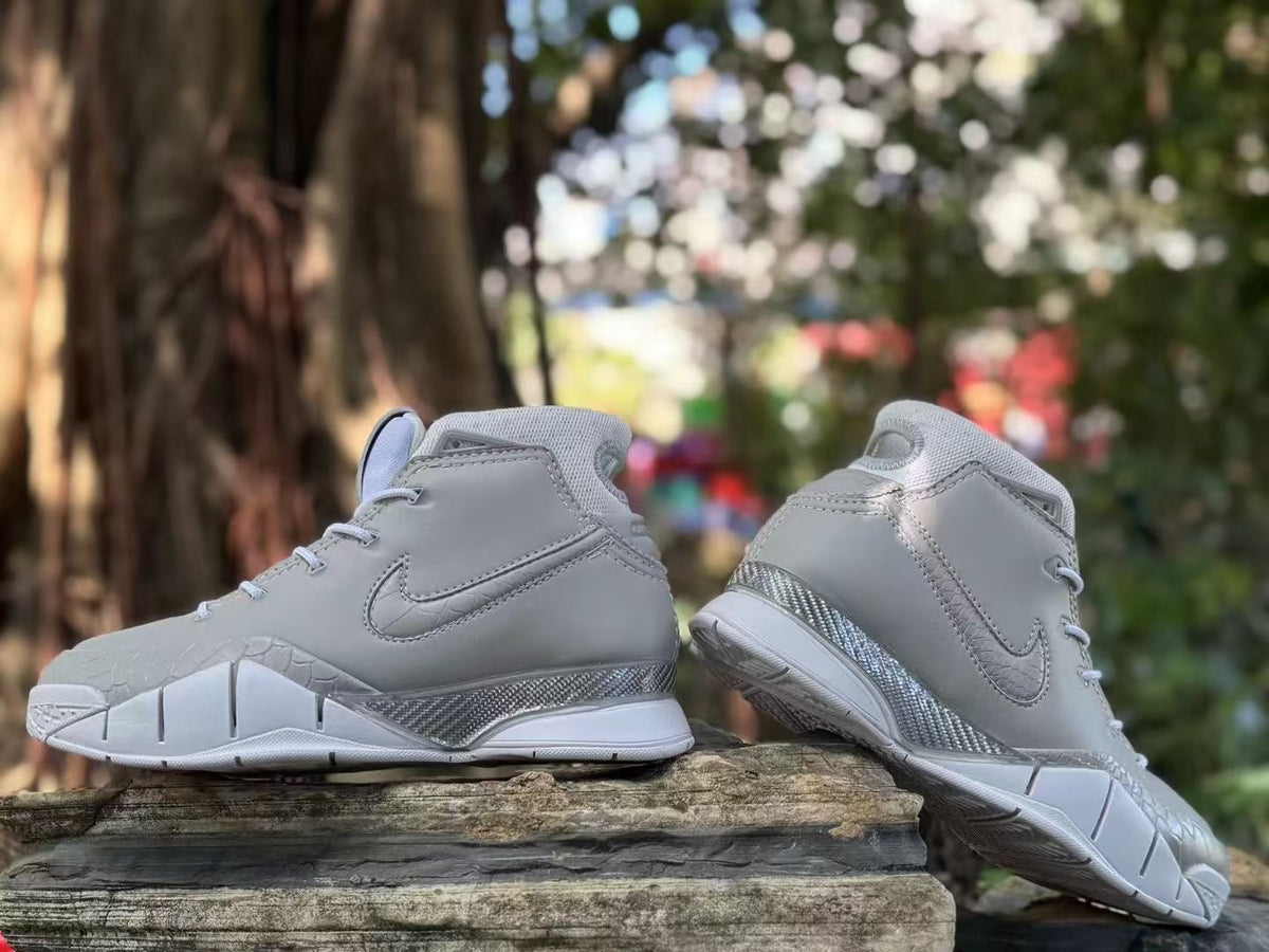 Side and rear views of the grey Nike Kobe 1 FTB shoes