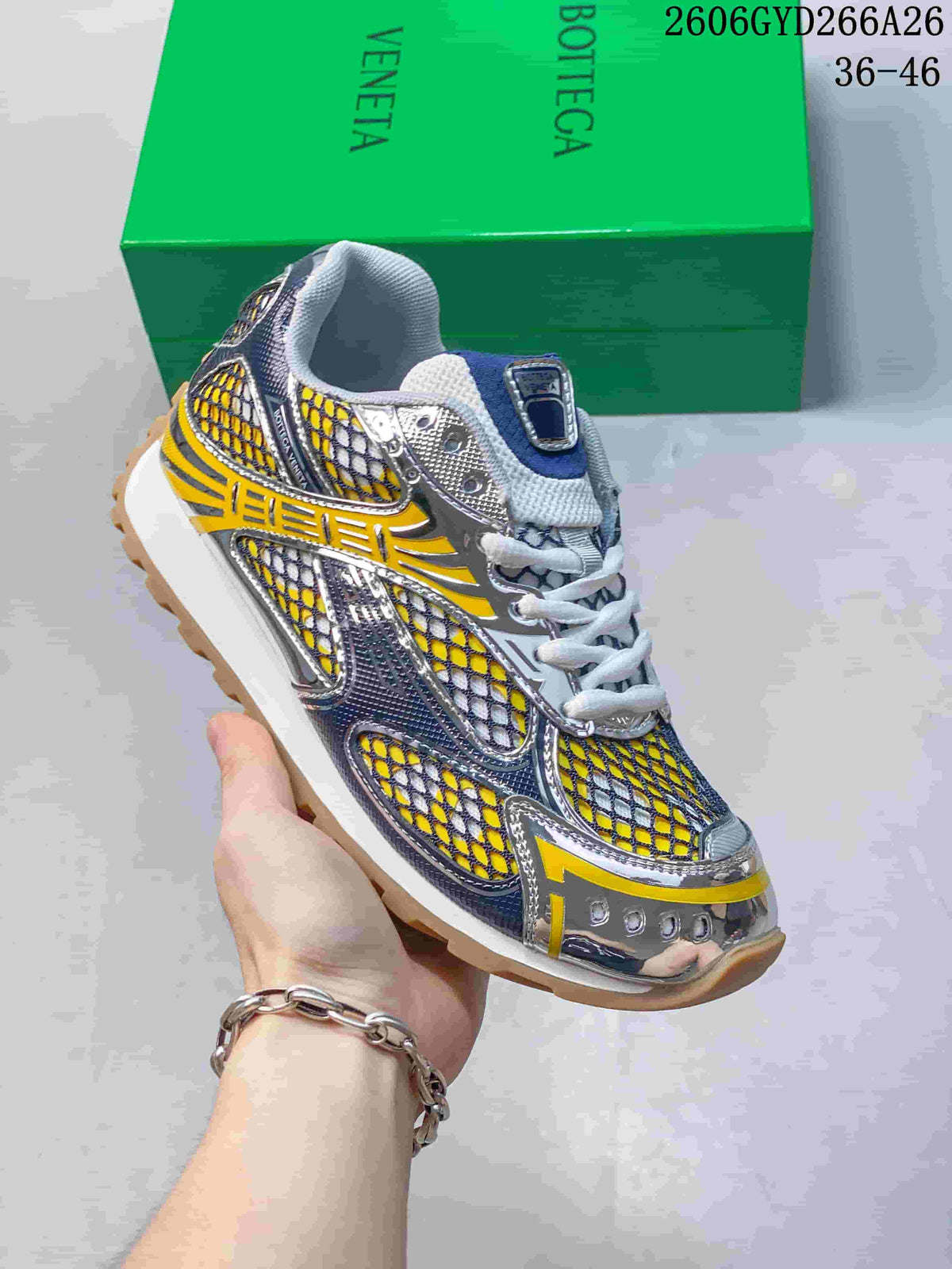 Angled view of the yellow, blue, silver-tone and white low-top sneaker