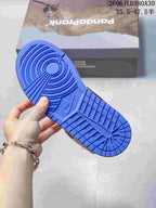 Bright blue outsole shown on the sneaker, with shoebox in the background.