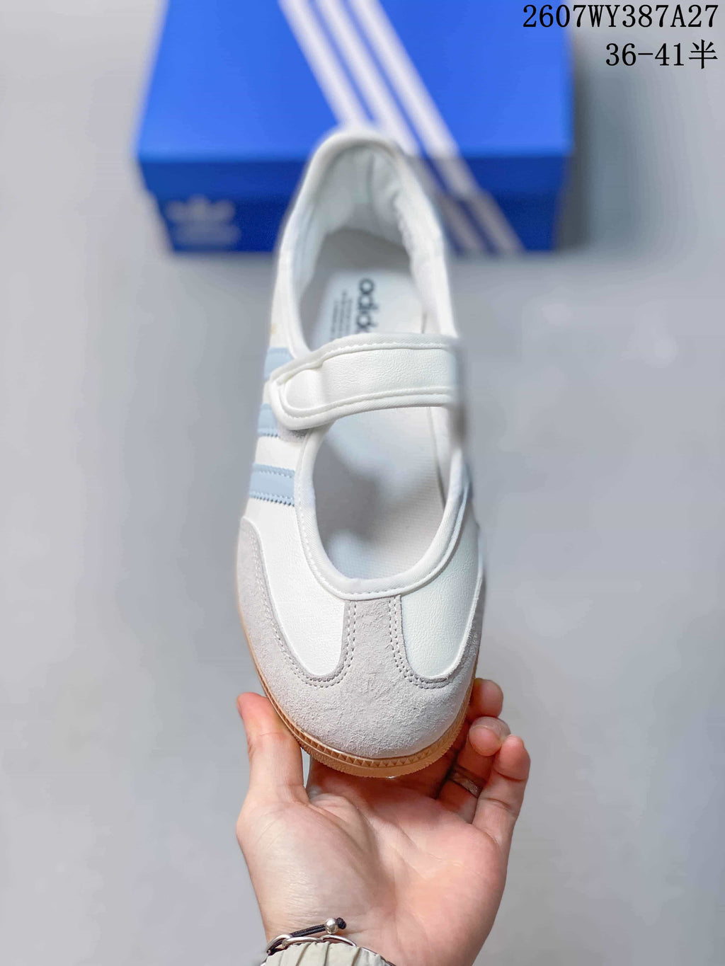 Top view showing the rounded toe, light blue stripes, padded opening, and adjustable forefoot strap.