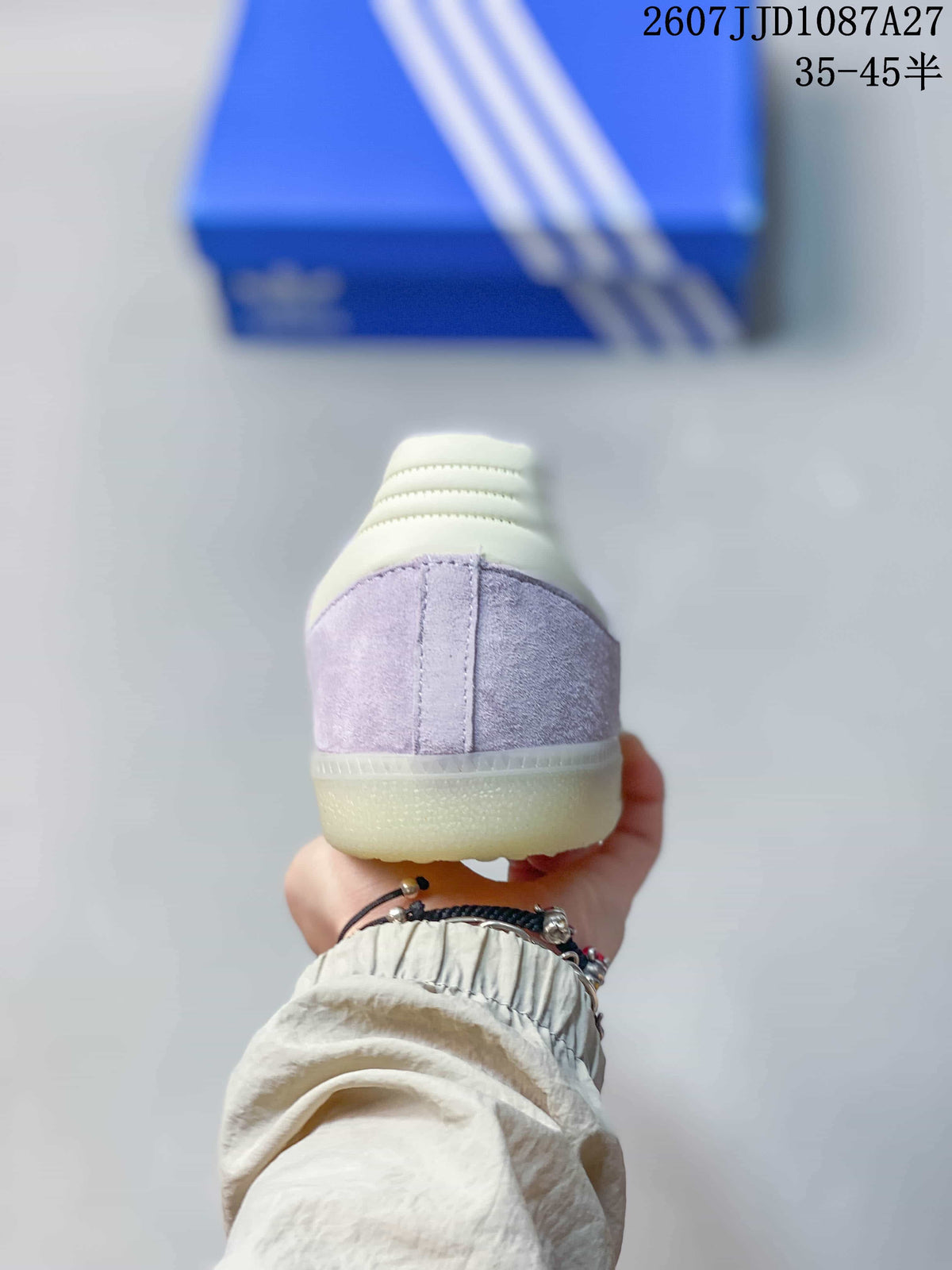 Rear view showing the lavender heel panels, cream heel collar, and translucent rubber outsole.
