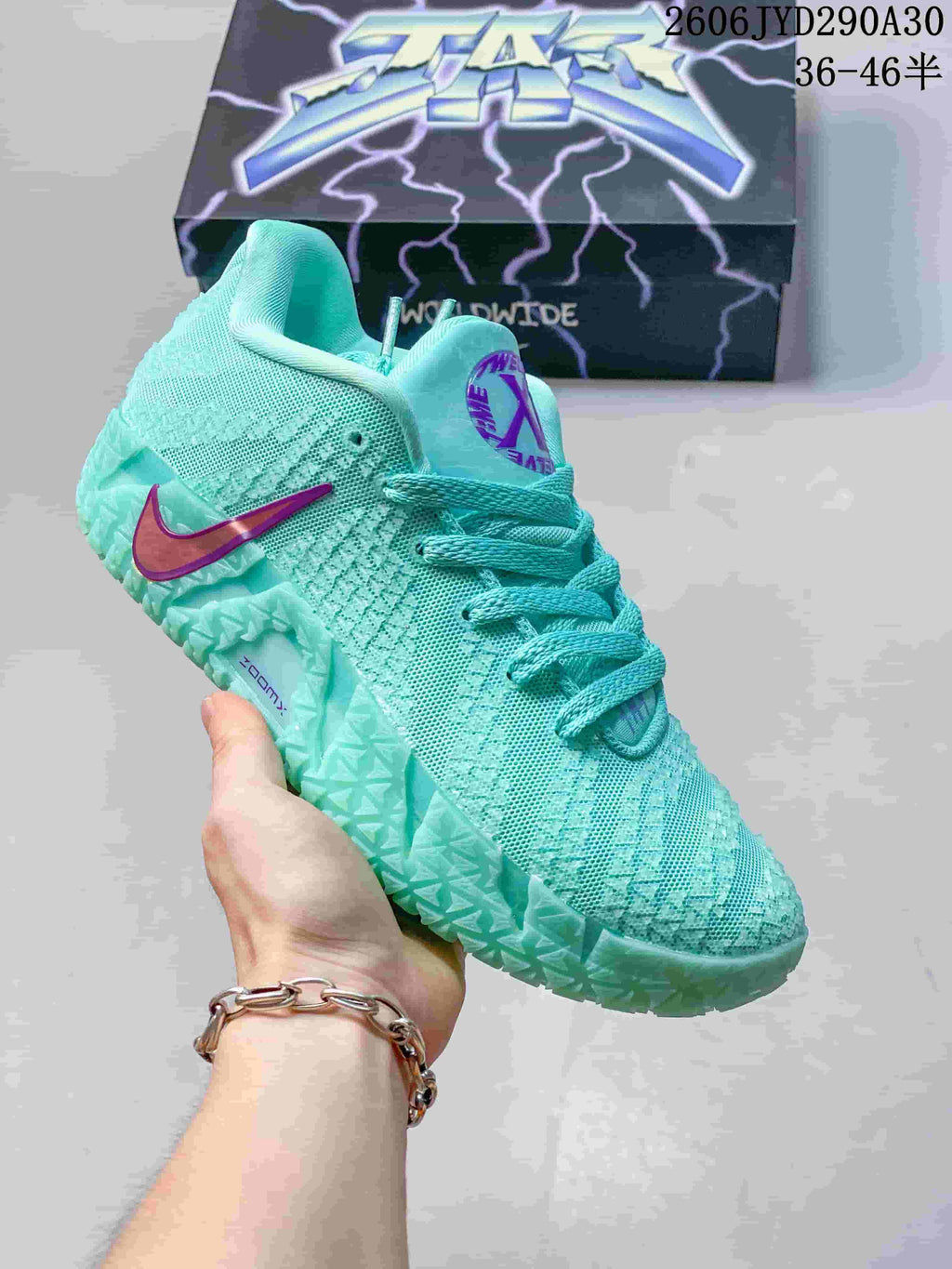 Aqua Nike Ja 3 basketball shoe with purple accents
