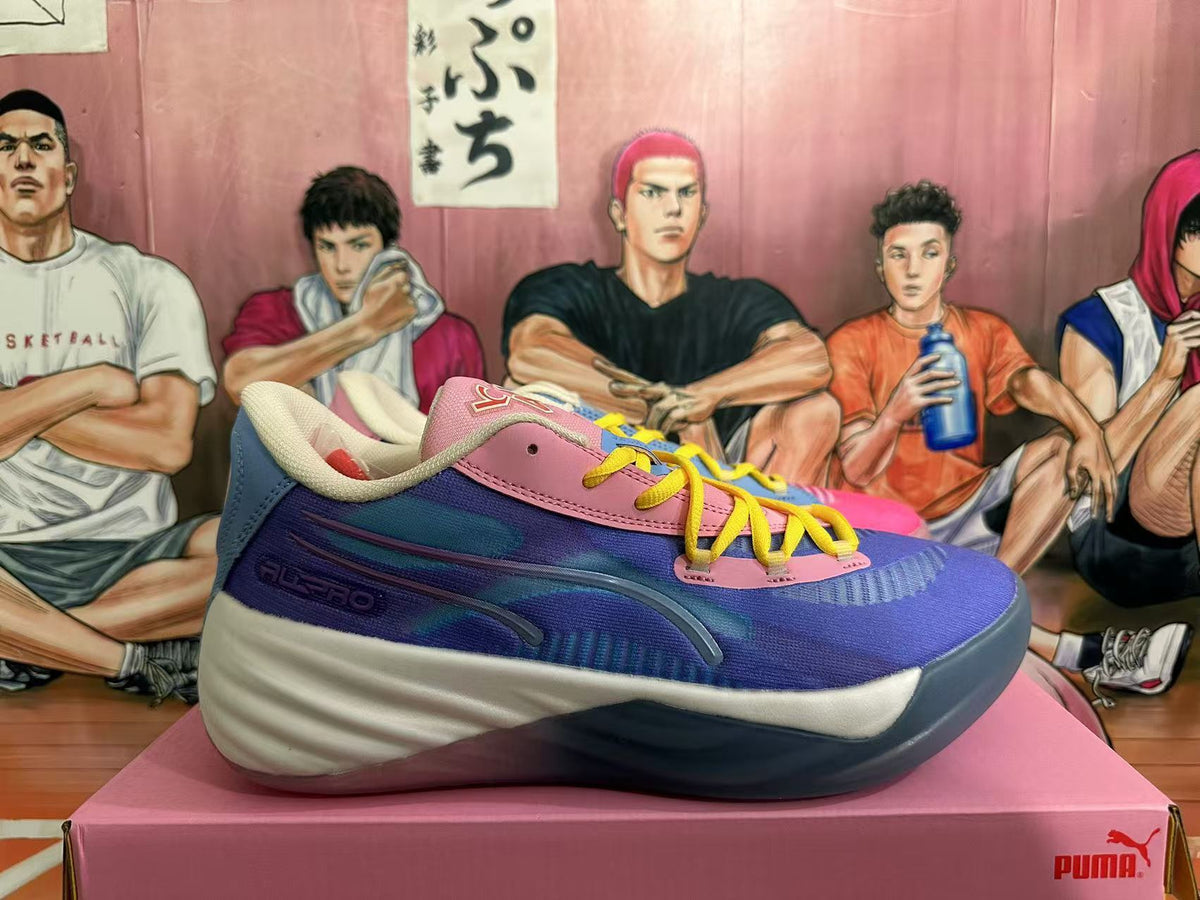 Side view of a blue and pink basketball shoe with cream and dark blue sole accents; ALL-PRO lettering is visible.