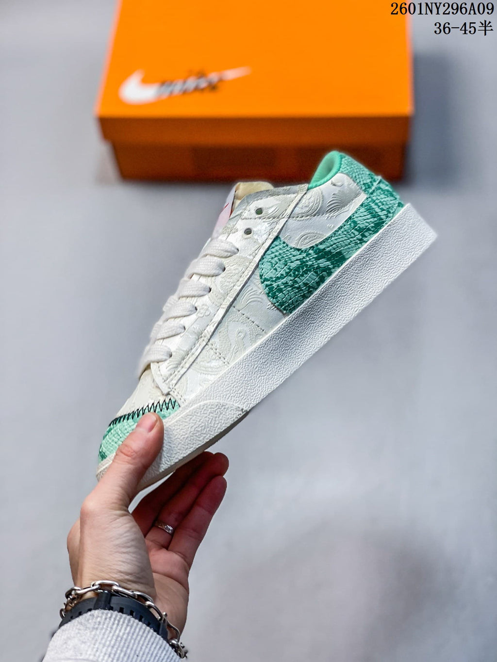 Side view highlighting the oversized green Swoosh and white textured upper.