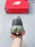 Rear view of the gray running shoe showing the padded heel, sculpted midsole, and outsole sections.