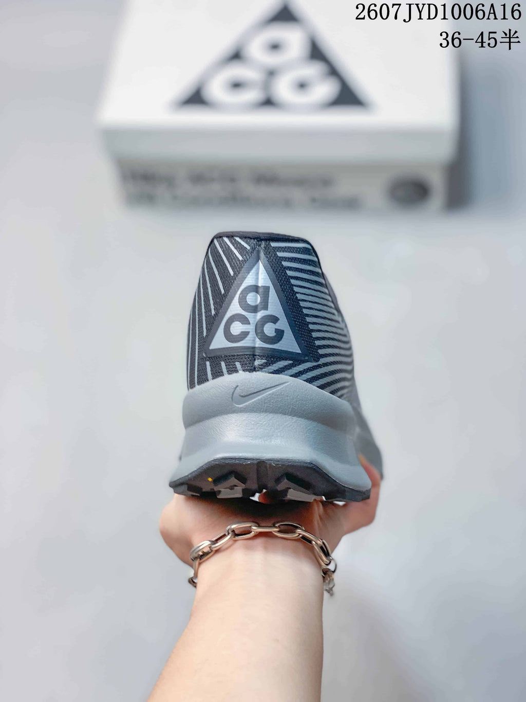 Rear view showing the gray heel, ACG branding, and black outsole.
