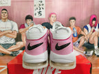 Rear view of white and pink Nike sneakers with black Swoosh details and sprinkle-like accents.