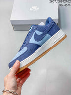 Side view of the blue Nike Air Force 1 sneaker with a gum outsole