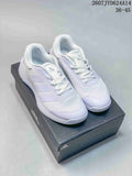 Pair of white adidas Dropset 4 training shoes displayed on a black adidas shoe box.