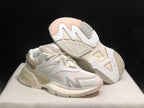 AMIRI MA Runner sneakers shown from an angled front view, including the patterned outsole of one shoe.