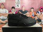 Side view of a black Nike sneaker showing mesh panels, layered overlays, and a visible heel air unit.