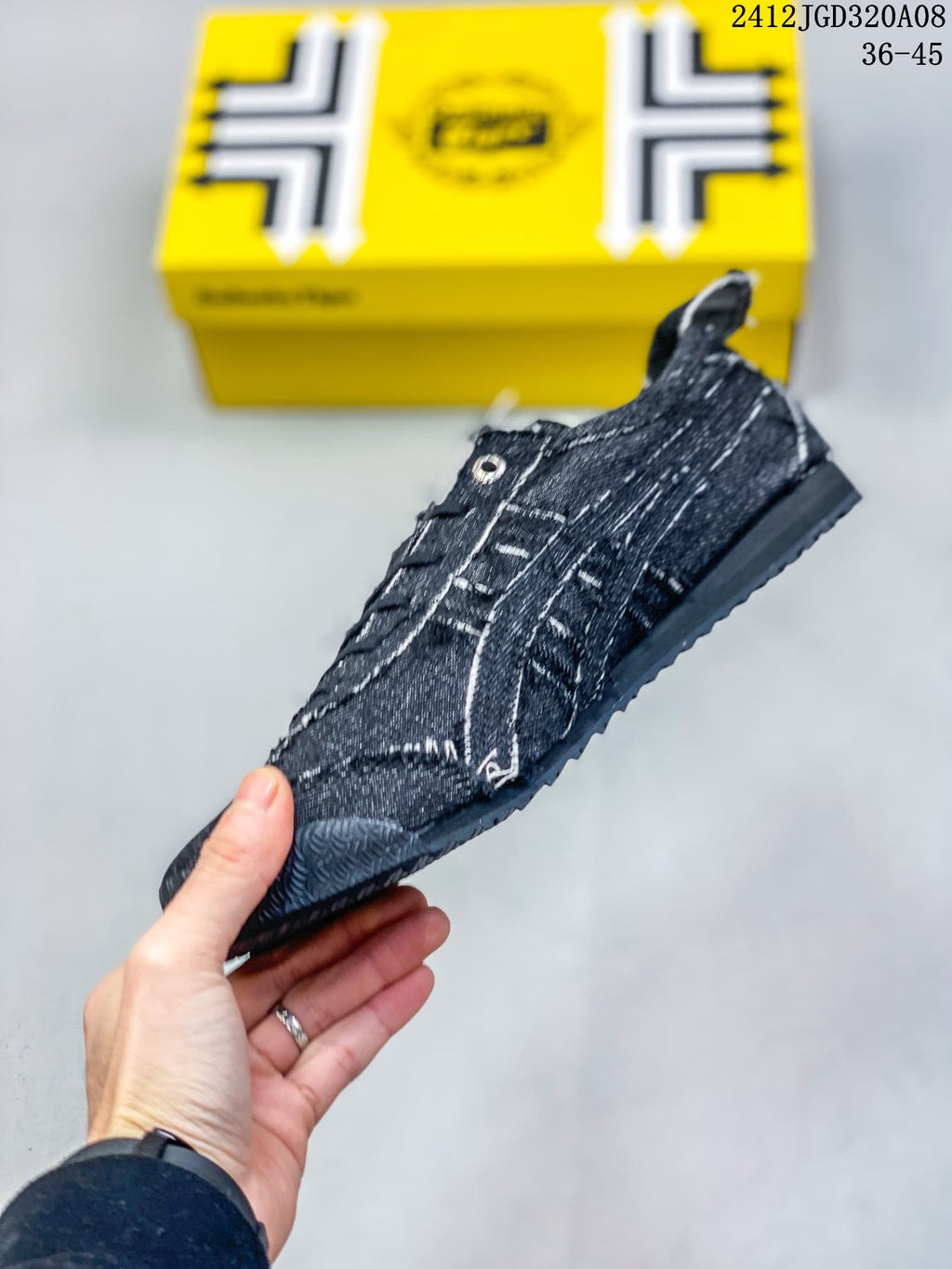 Side view highlighting the low-top silhouette, stitched panels, lace fastening, and textured outsole.